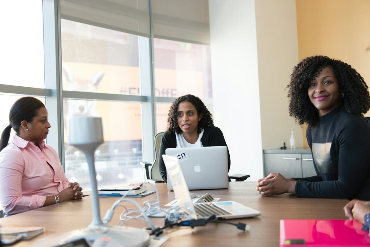 Nigerian and African professionals at work, in natural light.